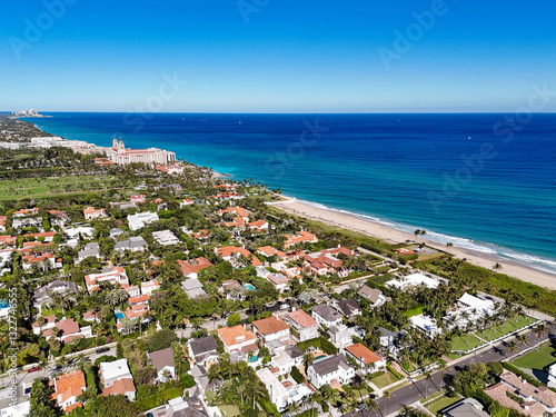 Luxury homes and apartments near Worth Ave with the Breakers Hotel in the background on Palm Beach in Palm Beach County, Florida