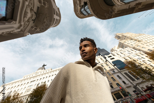 Fisheye. Modern portrait of man in Madrid city street 