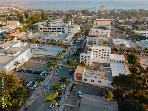 Aerial view of Ventura, California, USA, showcasing the downtown area with its palm-lined streets, buildings, and the iconic Ventura Pier extending into the Pacific Ocean.