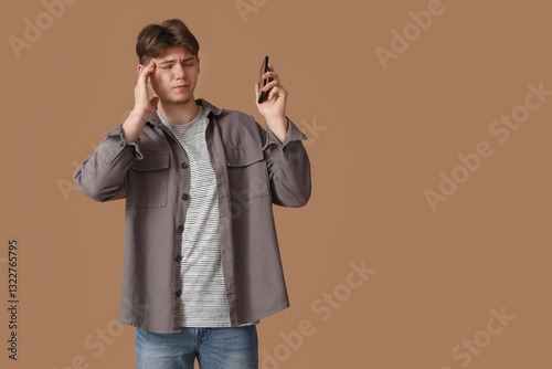 Young man with mobile phone...