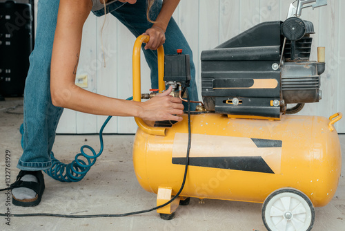 Skilled builder repairs equipment in a construction space