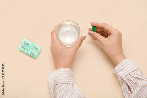 Female hands with glass of ...
