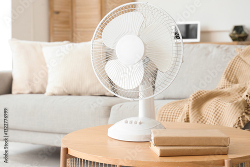 Bild auf Leinwand Interior of light living room with modern electric fan on coffee table, closeup