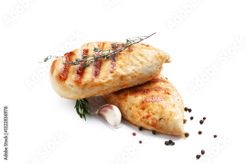Tasty grilled chicken breast with rosemary, thyme, peppercorns and garlic on white background