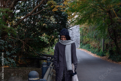 A woman walking down the street.