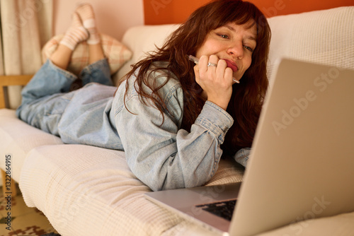 Satysfied Freelancer looking at her laptop