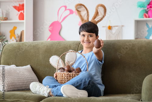 Cute boy in bunny ears with...