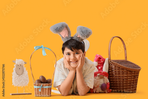 Cute boy in bunny ears with...