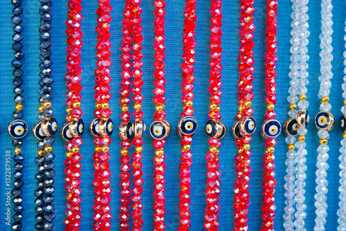 Colorful glass beads displayed for sale at a market stall