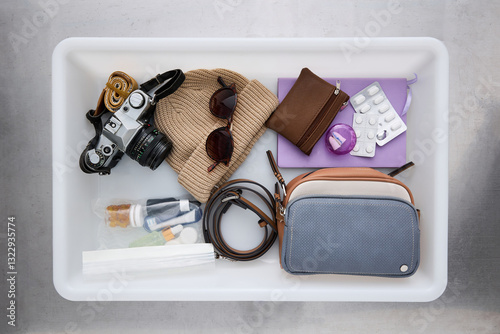 Assorted Travel Essentials in Airport Security checkpoint