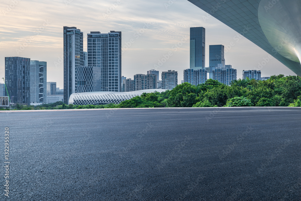 Asphalt road and modern city buildings on a cloudy day