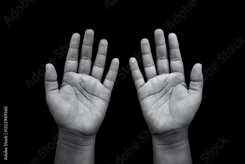 Two beggar hands palms up representing impoverished children, in black and white