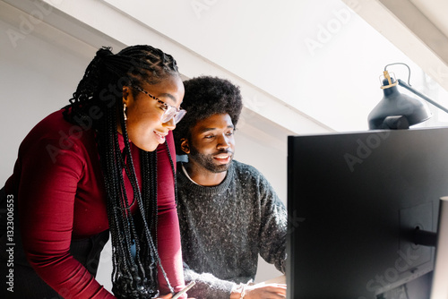 Black female supervisor gives feedback to a co-worker