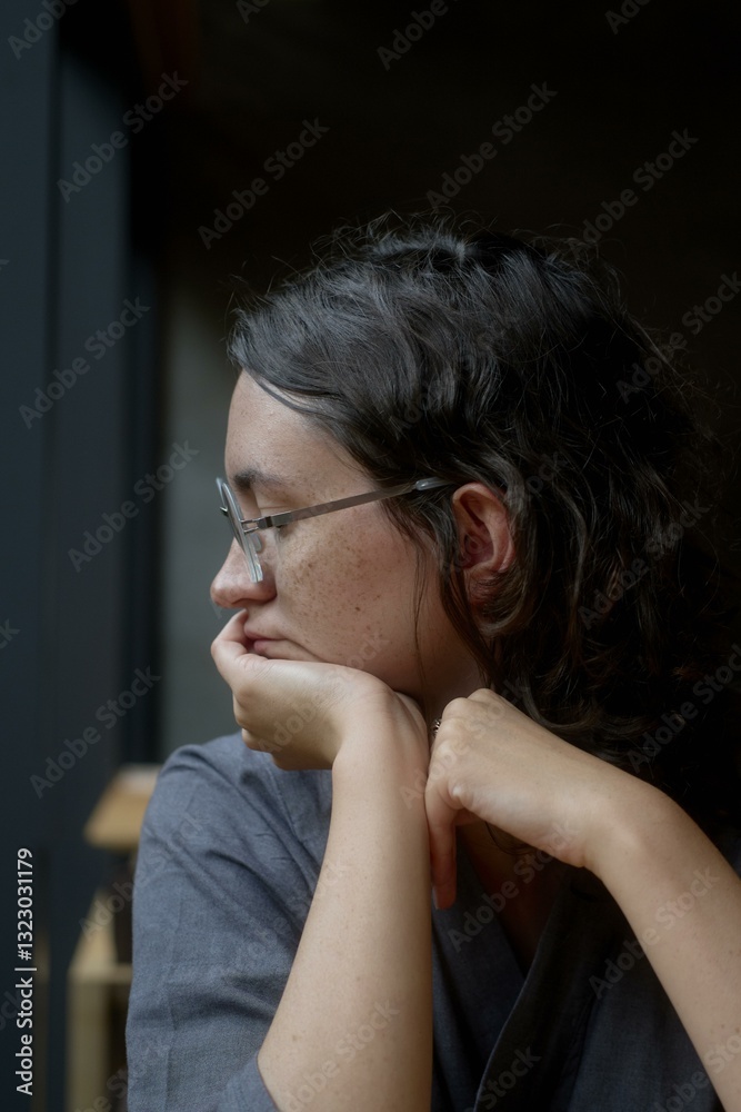 Contemplative moment in a cozy Japanese cafe during a rainy day Contemplative moment in a cozy Japanese cafe during a rainy day