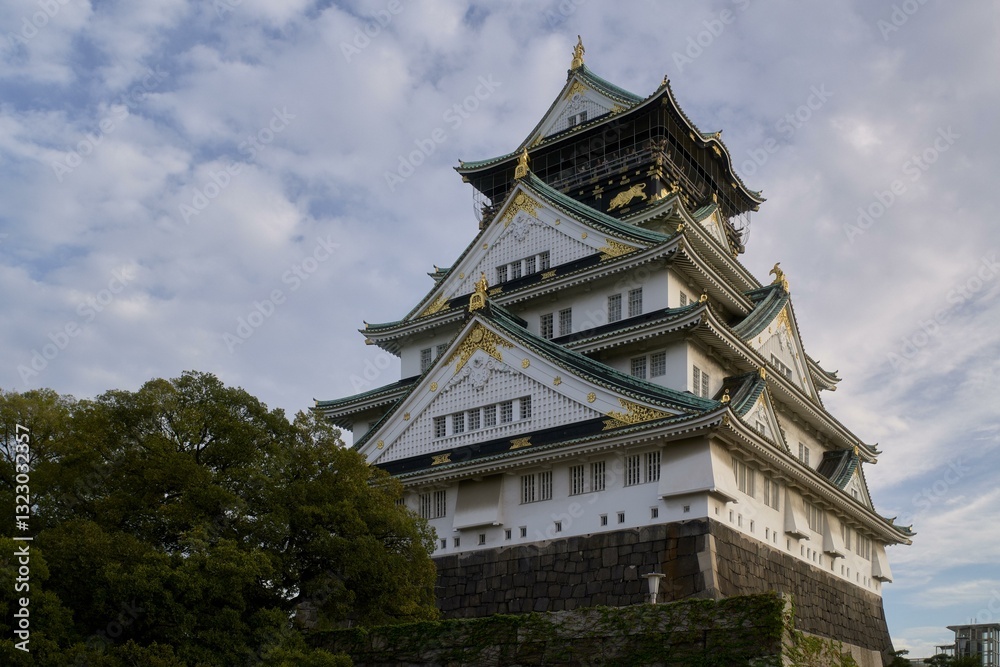 Majestic architecture of Osaka Castle under the expansive sky during Majestic architecture of Osaka Castle under the expansive sky during