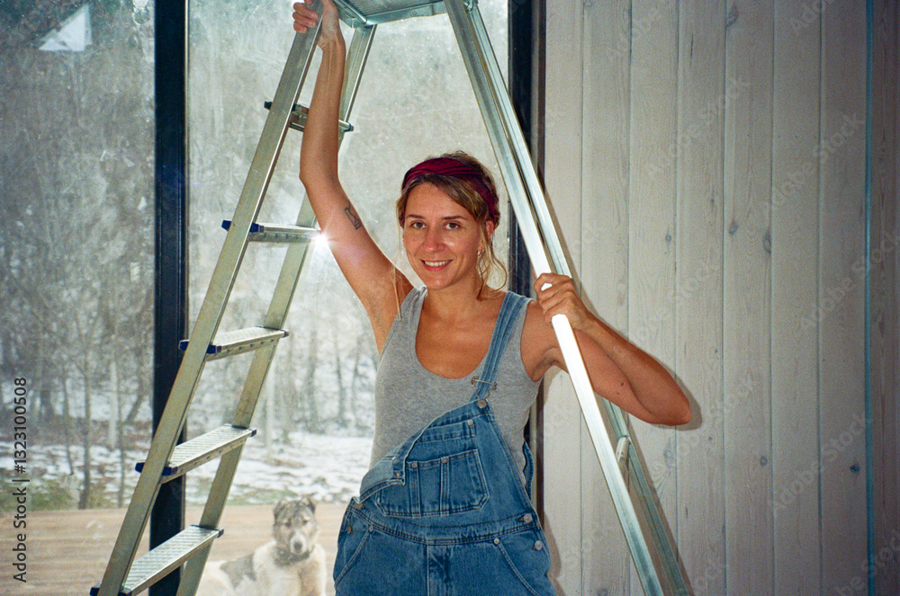© Alina Hvostikova/Stocksy - LGBTQ builder repairs a home while showcasing skills and confidence © Alina Hvostikova/Stocksy - LGBTQ builder repairs a home while showcasing skills and confidence