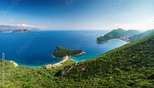 lush green peninsula extending into the deep blue sea the dense vegetation contrasts with the rugged rocky coastline creating a serene and untouched natural landscape budva montenegro photo