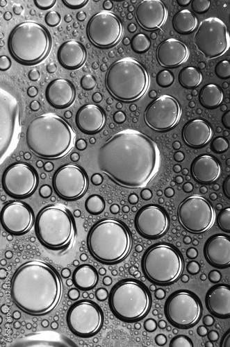 water condensation inside plastic bottle black=and=white macro photo