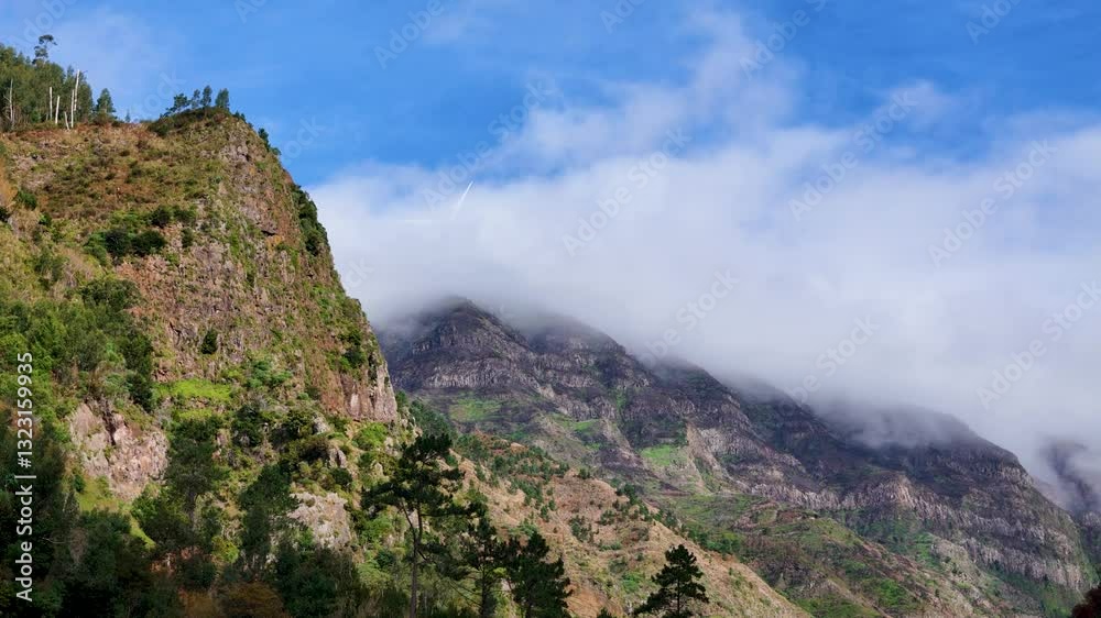 Cinematic Aerial of PR7 Levada do Moinho, Green Mountains and Spinning Wind Turbines in Clouds, Madeira Cinematic Aerial of PR7 Levada do Moinho, Green Mountains and Spinning Wind Turbines in Clouds, Madeira