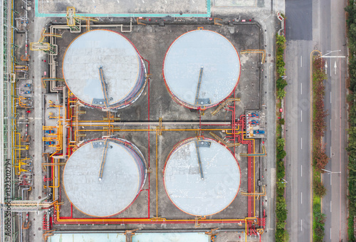 Massive Industrial Storage Tanks Connected by Pipelines in Open 