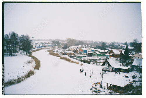 Winter activities in a snow-covered village with colorful houses photo