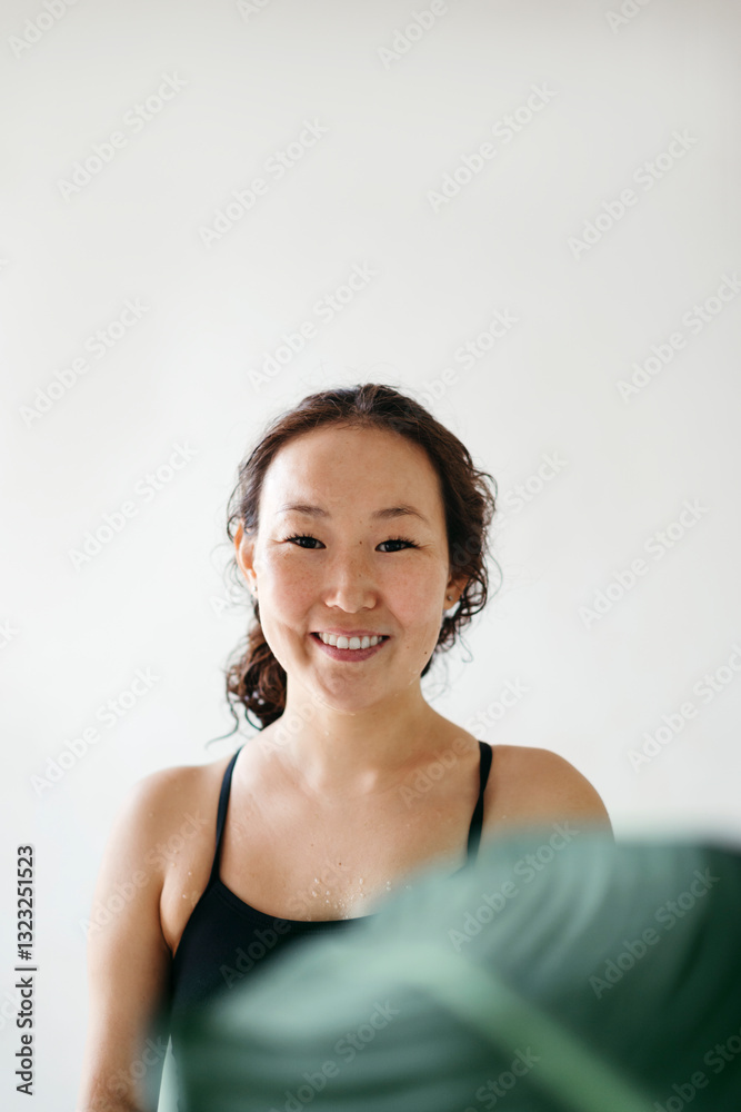 Smiling Woman in a Bright, Serene Indoor Space Smiling Woman in a Bright, Serene Indoor Space