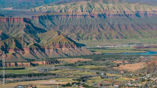 Aerial video of the mountains and valley. A mountain is an elevated portion of the Earth's crust, generally with steep sides that show significant exposed bedrock. 