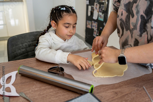 Child and Adult Baking Together at Home in a Cozy Kitchen photo