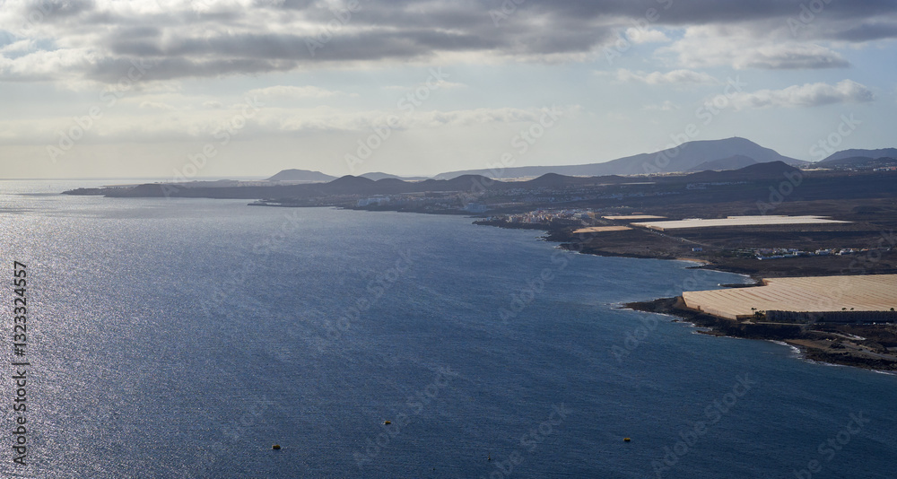 Tenerife coastline view with shimmering ocean........ Tenerife coastline view with shimmering ocean........