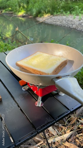 Toasting Buttered Bread on a Portable Stove – Outdoor Cooking by the River