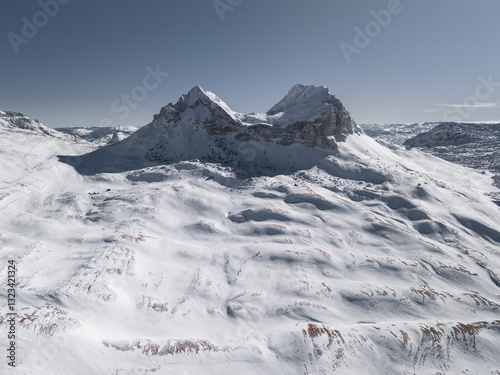 Winter twin peaks mountain and blue sky.  photo