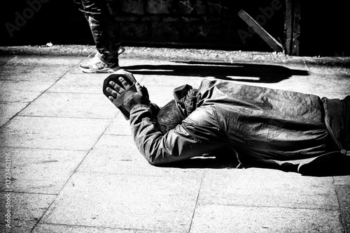 A devoted Tibetan pilgrim prostrating on the way to the Potala Palace in Lhasa, showcasing deep spirituality, faith, and perseverance on a sacred Buddhist journey