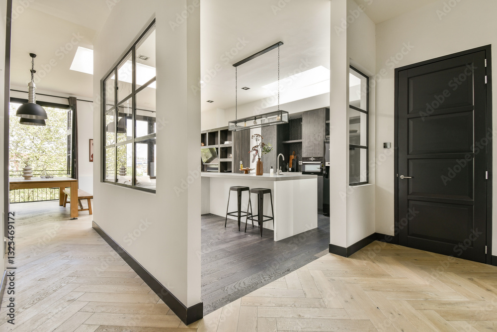 A sleek and contemporary kitchen featuring a minimalist aesthetic with dark cabinetry, light countertops, and an open layout that enhances space and functionality. A sleek and contemporary kitchen featuring a minimalist aesthetic with dark cabinetry, light countertops, and an open layout that enhances space and functionality.