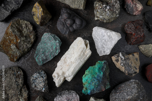 Mixture of critical minerals (United States of America definition), or critical raw materials (European Union definition). Flatlay on slate background