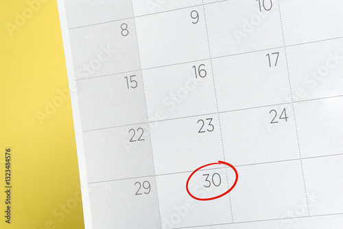 Red circle. Close up of a date 30 with red circles on a calendar. Concept Last days of month.