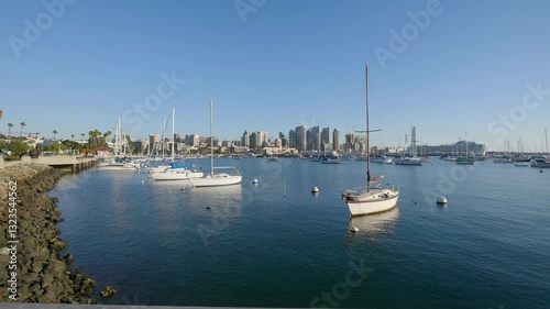 Marina with boats and downtown in the background on a clear day in San Diego, California in 4k