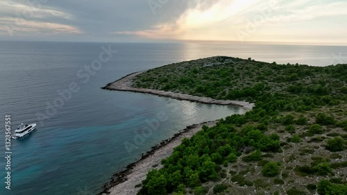 Lonely yacht moored near an island in Kornati, Croatia. Aerial. photo