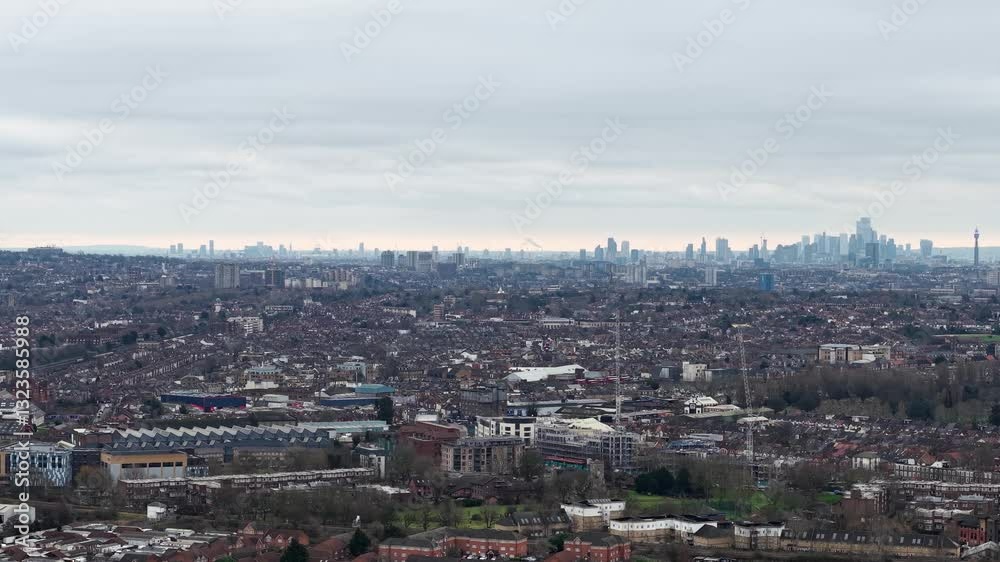 Distant View Of City Skyline From Wembley Suburb In London Borough of Brent, UK. aerial sideways shot Distant View Of City Skyline From Wembley Suburb In London Borough of Brent, UK. aerial sideways shot