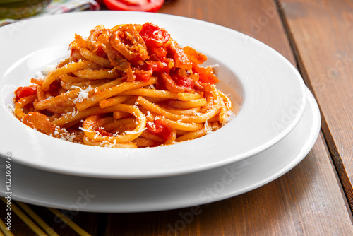 Fototapeta Naklejka Na Ścianę i Meble -  Bucatini all'amatriciana, ricetta tradizionale di pasta della cucina romana, cibo italiano, gastronomia europea 