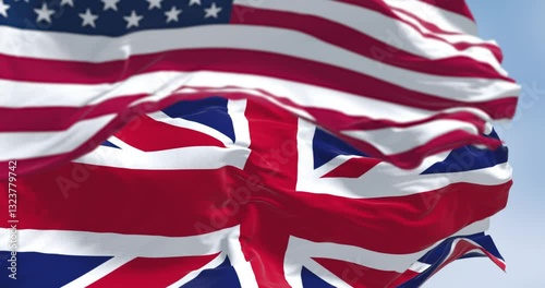 National flag of the Unites States and United Kingdom waving in the wind