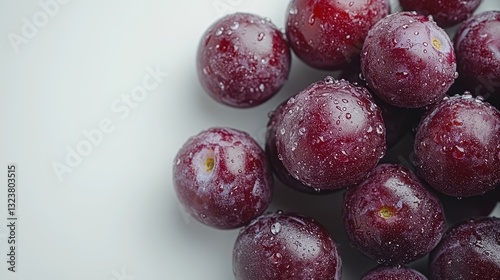 Wallpaper Mural A vibrant cluster of plump, dark purple plums, their skin glistening with moisture, rests on a pristine white backdrop, a testament to nature s beauty and the simple pleasures of life. Torontodigital.ca