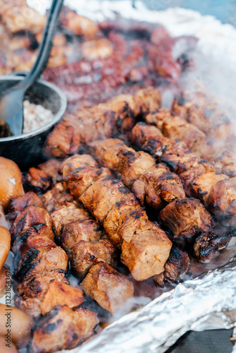 Grill chicken shashlik meat and sausages on fair, farmers market stand.