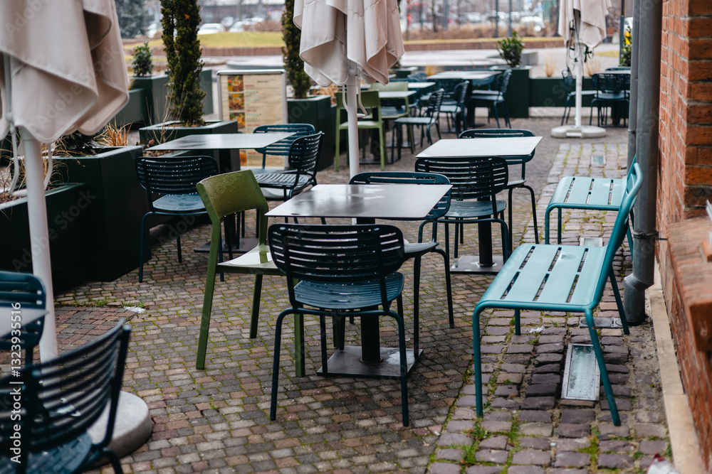 Outdoor cafe seating with tables and chairs