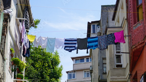 laundry and clothes hanging on a rope outside in the old city