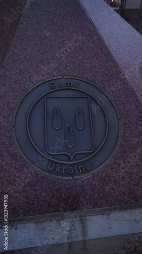 Stone signpost of different countries of Europe or the world and some cities in the German old town shows the direction to the city of Sumy in Ukraine