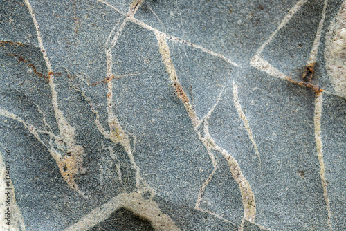A livid grey texture of giant pebbles