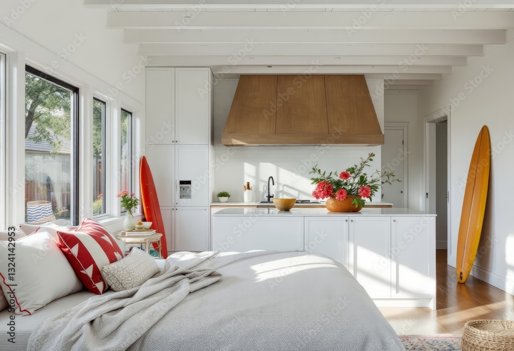 Modern coastal-themed kitchen and living room featuring white decor, wood accents, red and green highlights, and stylish furnishings