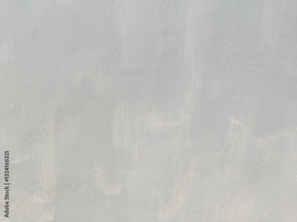 Naklejka premium Abstract Grunge Decorative Rough Uneven Stucco Wall Background Art texture.Raw And Weathered Concrete Texture In Soft Gray With Subtle Layered Patterns For A minimalist And Urban Aesthetic Texture.