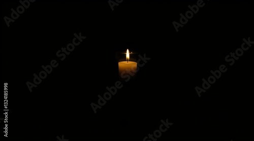 A solitary white candle flickers softly against a black background, creating a serene and tranquil atmosphere.
