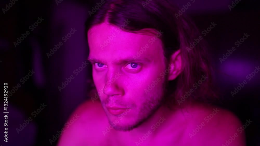 man in neon light at night at work place at home eating man in neon light at night at work place at home eating